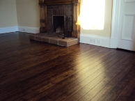 Narrow pine boards with brown oak stain